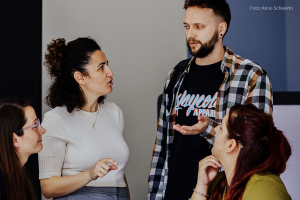 A team discusses a workshop topic together